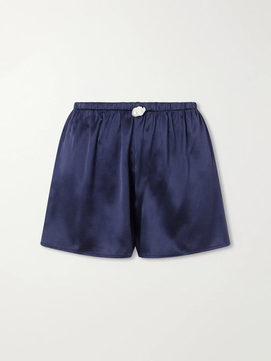 Image of a model wearing Shorts. Product name - Playa Silk Shorts in Navy colour by brand - Sara Cristina
