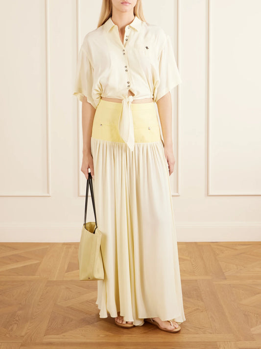Image of a model wearing Skirts. Product name - Cotton And Crepe Maxi Skirt in Yellow colour by brand - RABANNE
