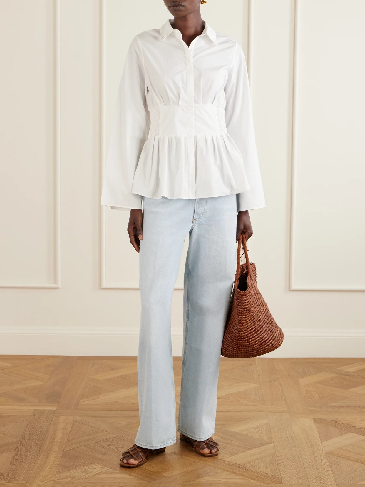 Image of a model wearing Tops. Product name - Boogie Woogie Bugle Boy Shirred Cotton-poplin Blouse in White colour by brand - Rosie Assoulin