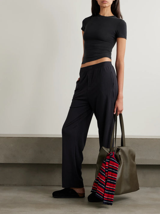 Image of Sleepwear & Loungewear. Product name - Stretch-cotton Jersey T-shirt - Soot in Black colour by brand - SKIMS