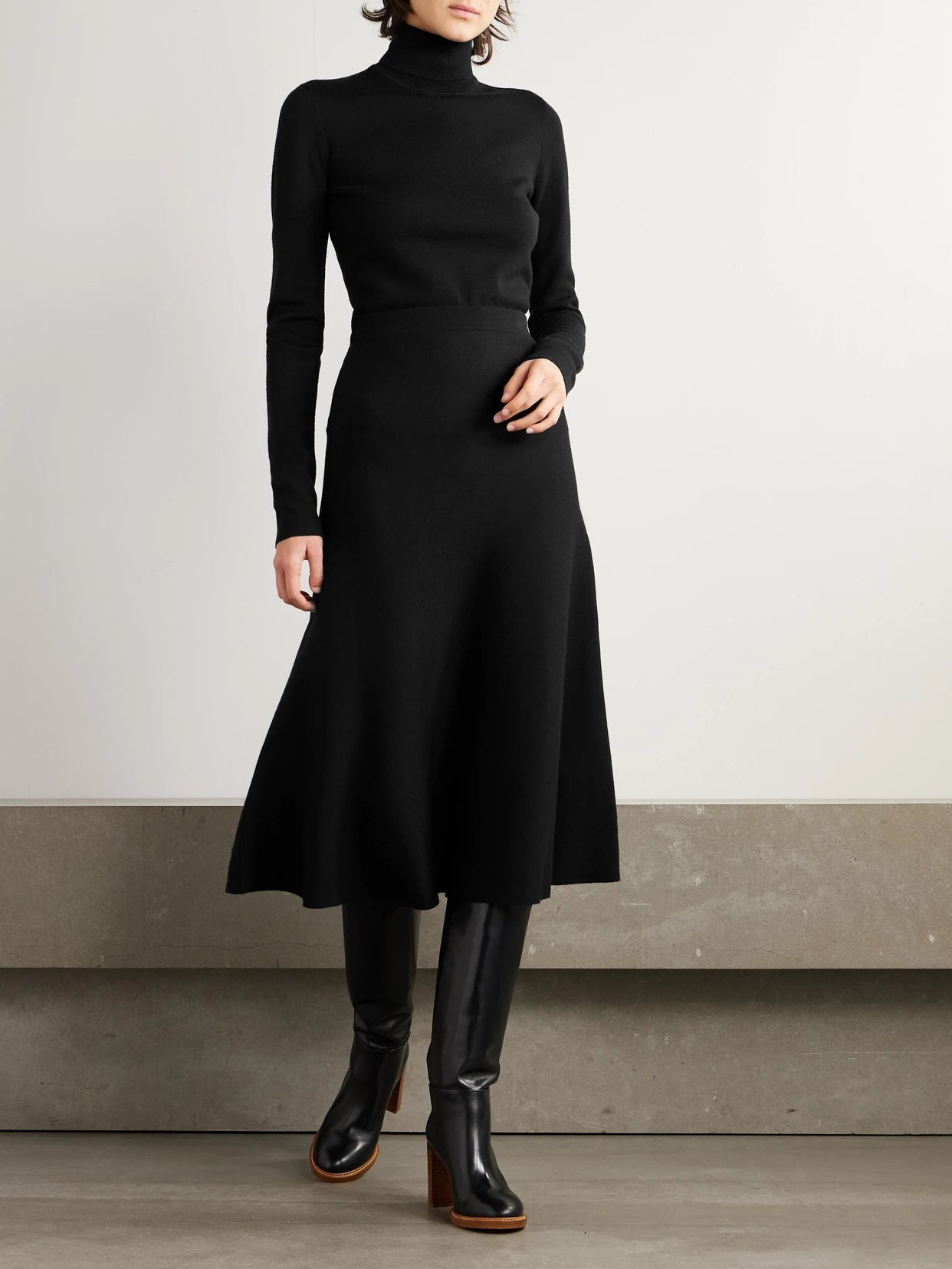 Image of a model wearing Skirts. Product name - Freddie Wool, Cashmere And Silk-blend Midi Skirt in Black colour by brand - Gabriela Hearst