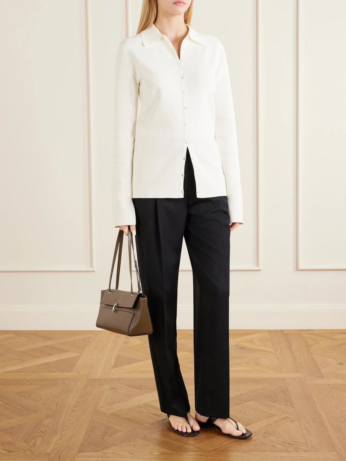 Image of a model wearing Outerwear. Product name - Knitted Cardigan in White colour by brand - TOTEME