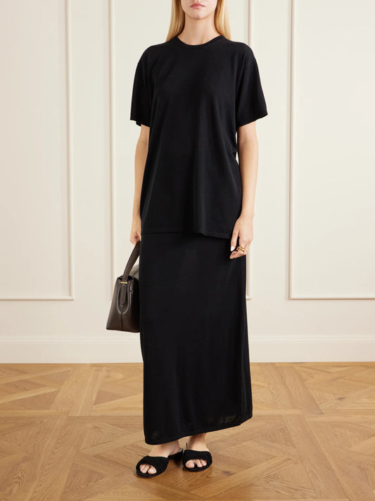 Image of a model wearing Tops. Product name - Lyocell And Cashmere-blend T-shirt in Black colour by brand - TOTEME