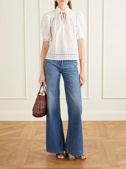 Image of a model wearing Tops. Product name - Alouette Cotton-blend Broderie Anglaise Shirt in White colour by brand - Ulla Johnson