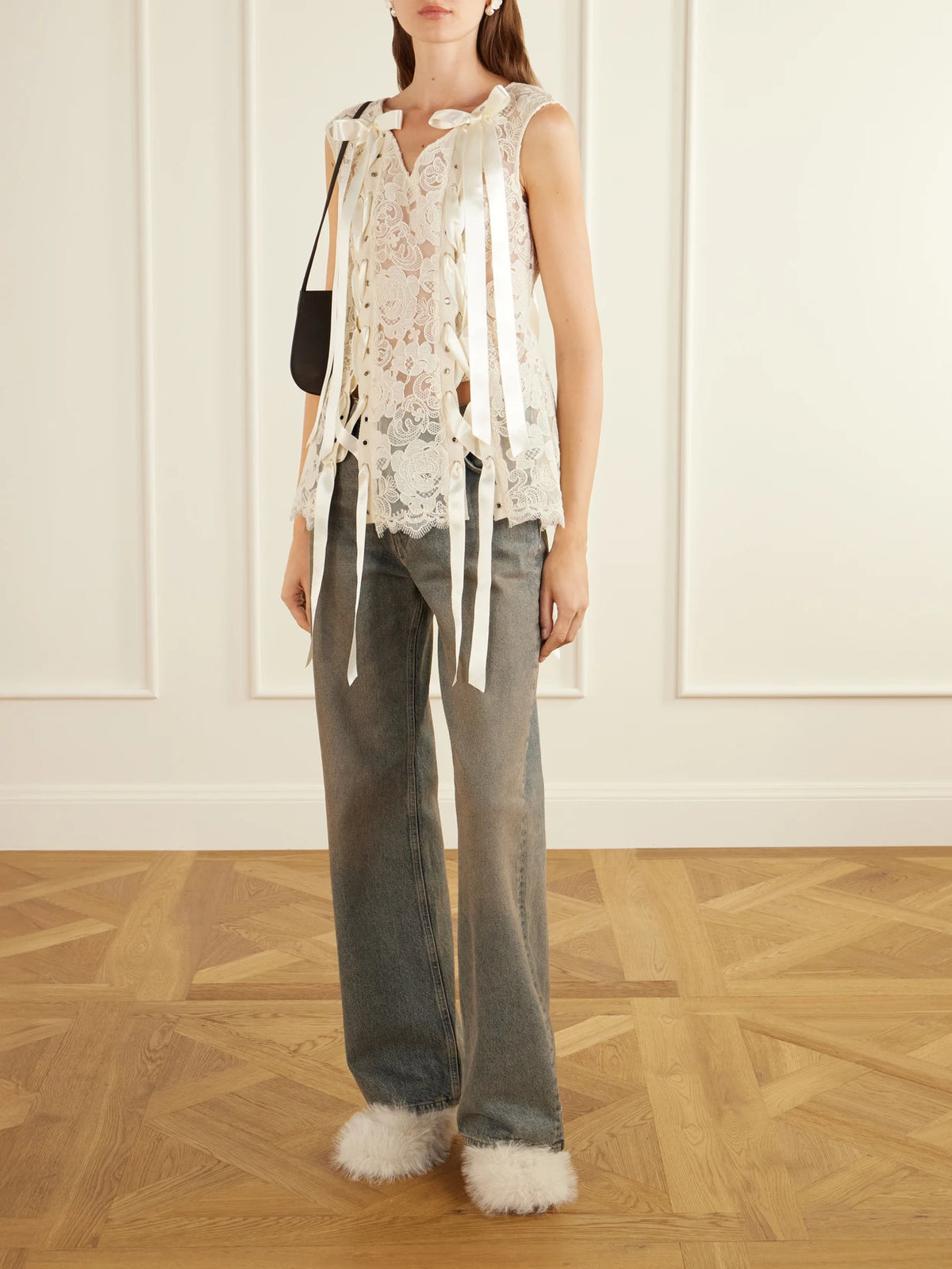 Image of a model wearing Tops. Product name - Unraveling Ribbon Portrait Bow-detailed Lace Top in Ecru colour by brand - Simone Rocha