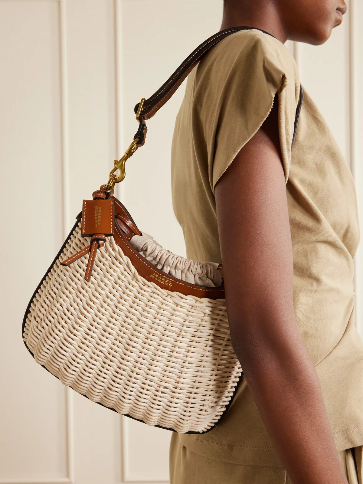 Image of Bags. Product name - Oskan Wicker Leather-trimmed Wicker Shoulder Bag in Neutral colour by brand - ISABEL MARANT