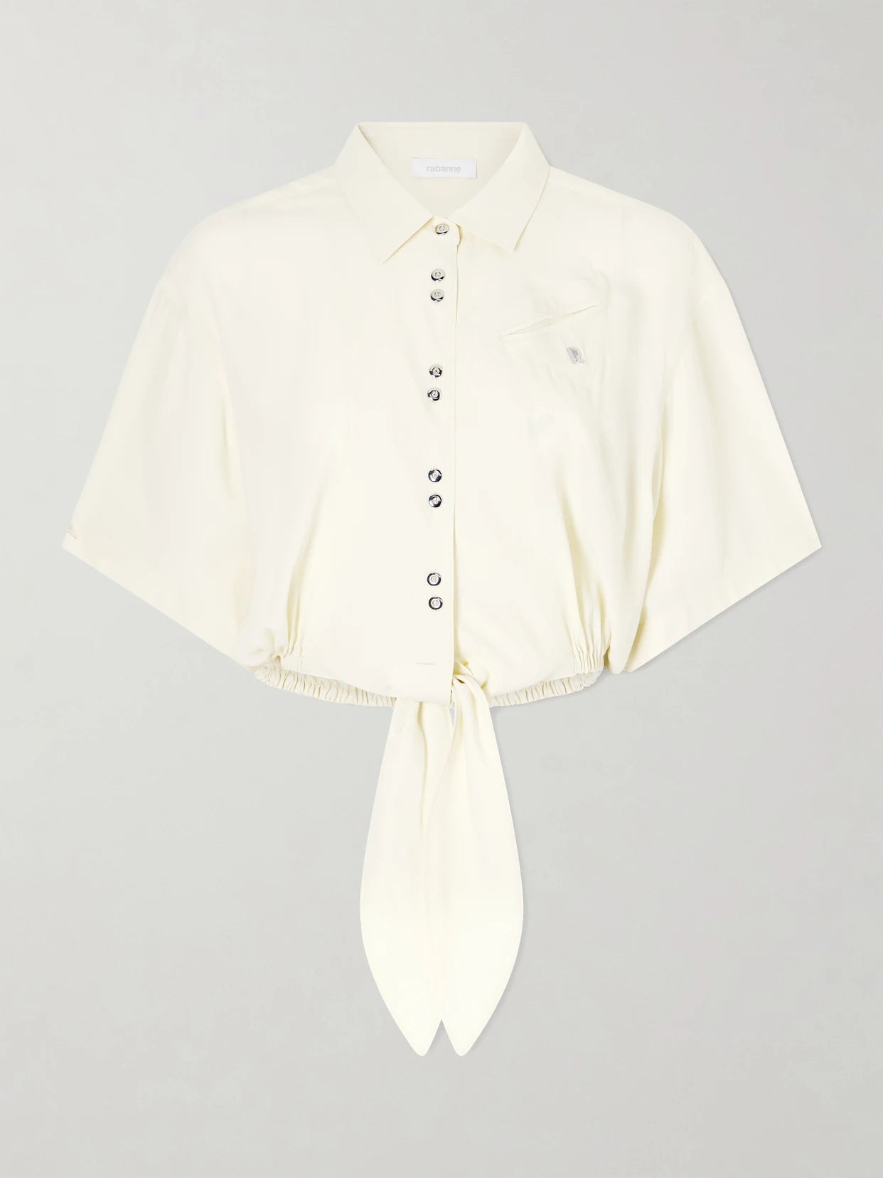 Image of a model wearing Tops. Product name - Logo-embellished Knotted Blouse in Yellow colour by brand - RABANNE