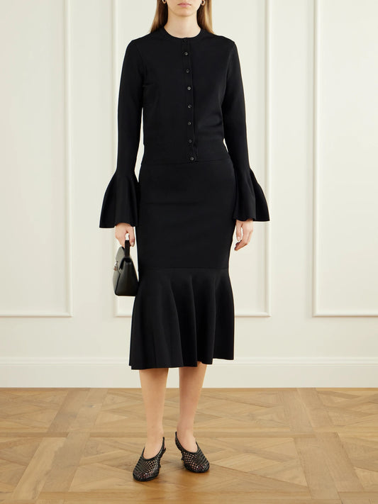 Image of a model wearing Skirts. Product name - Flared Crepe Midi Skirt in Black colour by brand - Stella McCartney