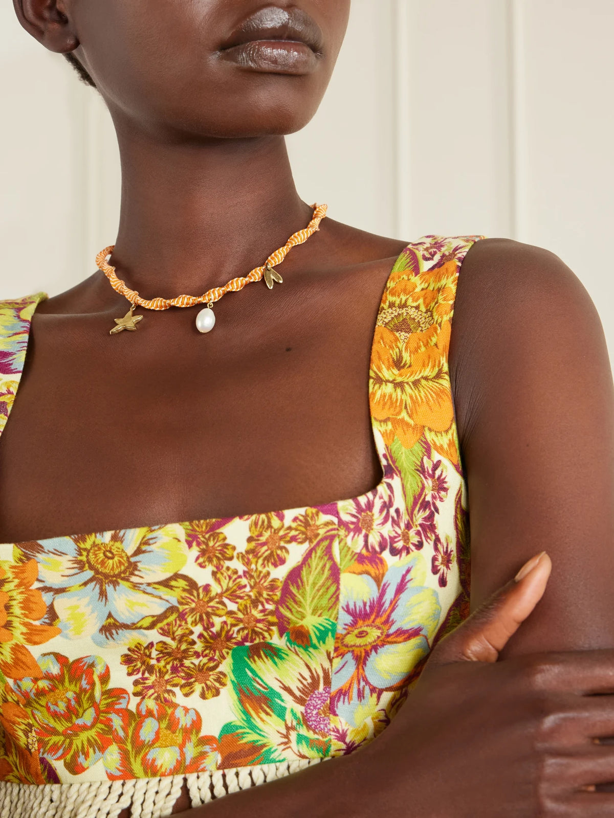 Image of Necklaces. Product name - Calypso Macrame And Pearl Charm Necklace in Multi colour by brand - ALÉMAIS