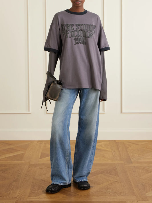Image of a model wearing Tops. Product name - Logo-print Cotton-jersey T-shirt in Dark purple colour by brand - Acne Studios