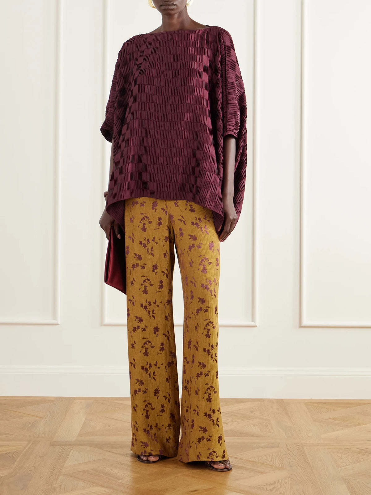 Image of a model wearing Tops. Product name - Plissé Satin Blouse in Purple colour by brand - Dima Ayad