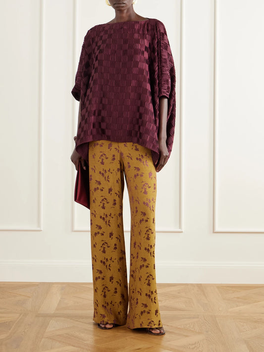 Image of a model wearing Tops. Product name - Plissé Satin Blouse in Purple colour by brand - Dima Ayad