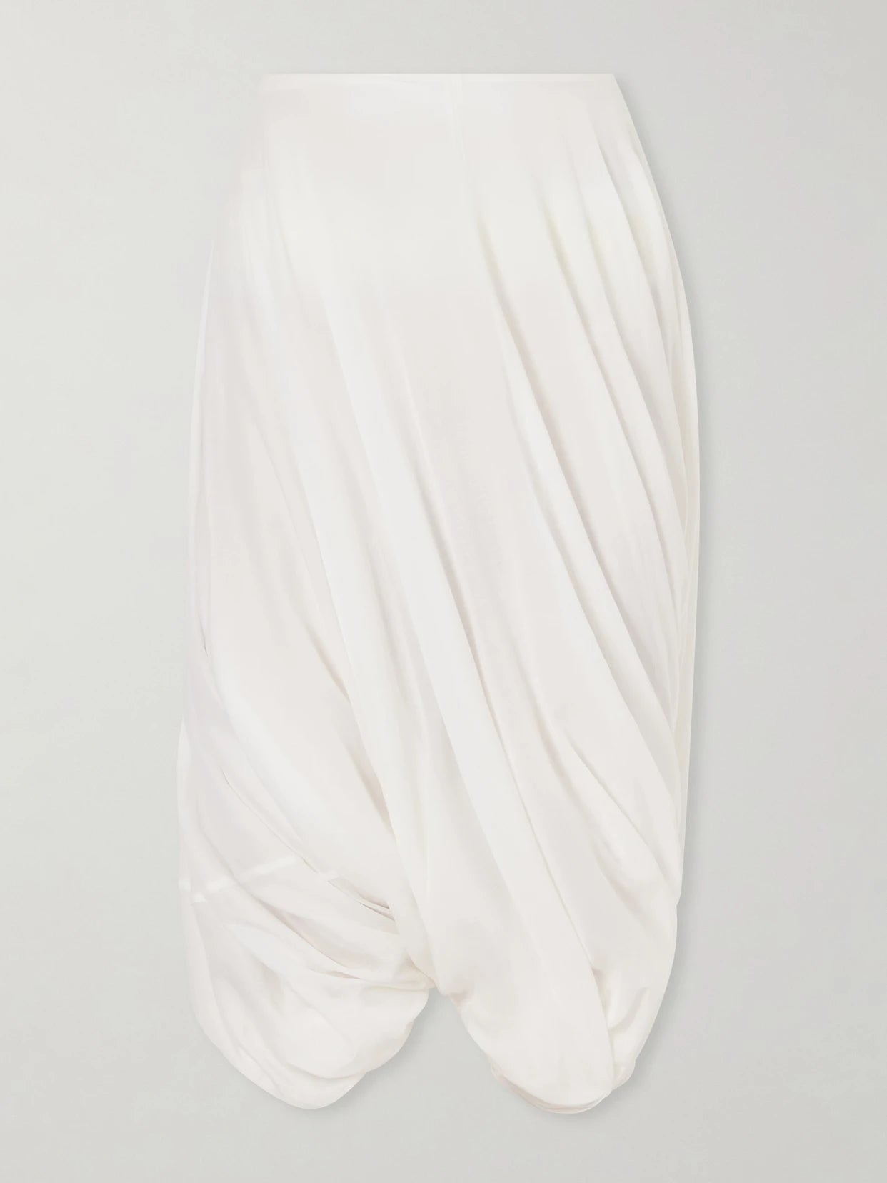 Image of a model wearing Skirts. Product name - Cocoon Pleated Lyocell And Cotton-blend Maxi Skirt in White colour by brand - TOTEME
