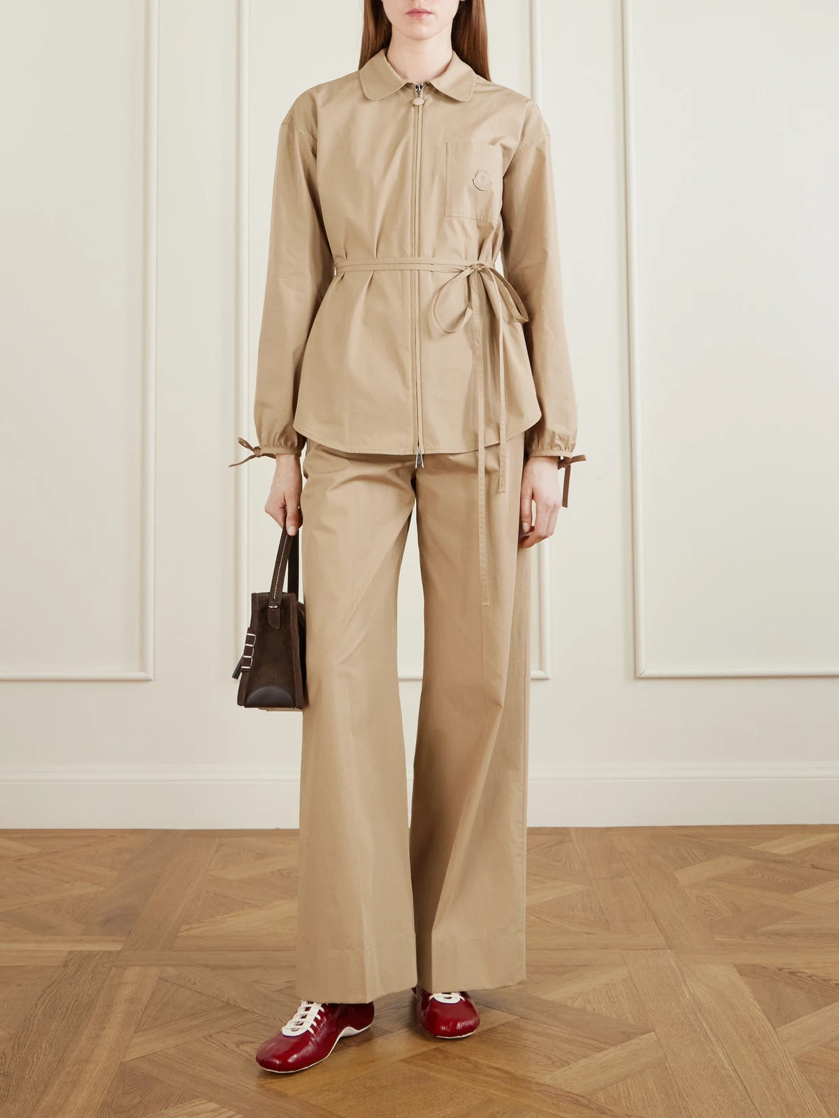 Image of a model wearing Pants. Product name - Cotton-poplin Wide-leg Pants in Camel colour by brand - Moncler