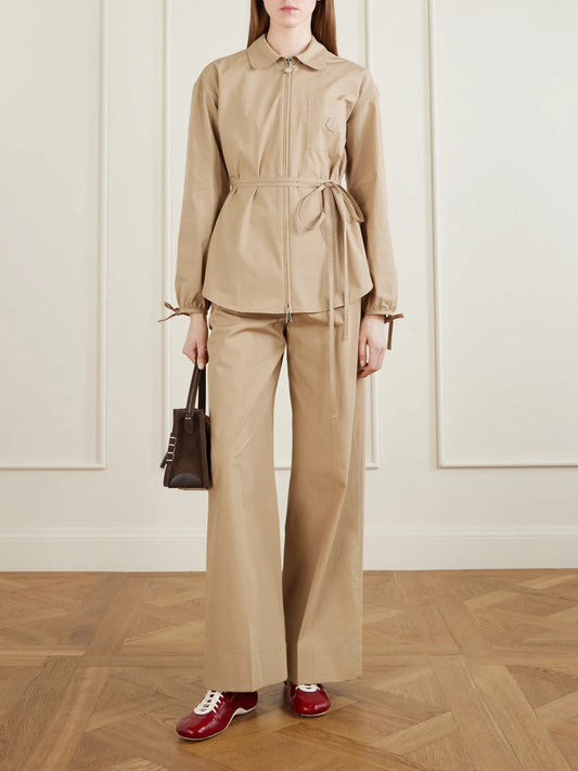 Image of a model wearing Pants. Product name - Cotton-poplin Wide-leg Pants in Camel colour by brand - Moncler