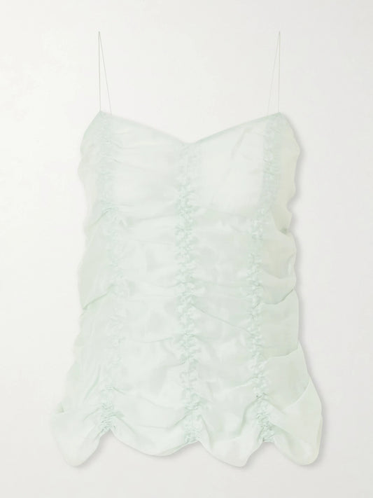 Image of a model wearing Tops. Product name - Inara Ruched Lyocell And Silk-blend Tank in Light green colour by brand - KHAITE