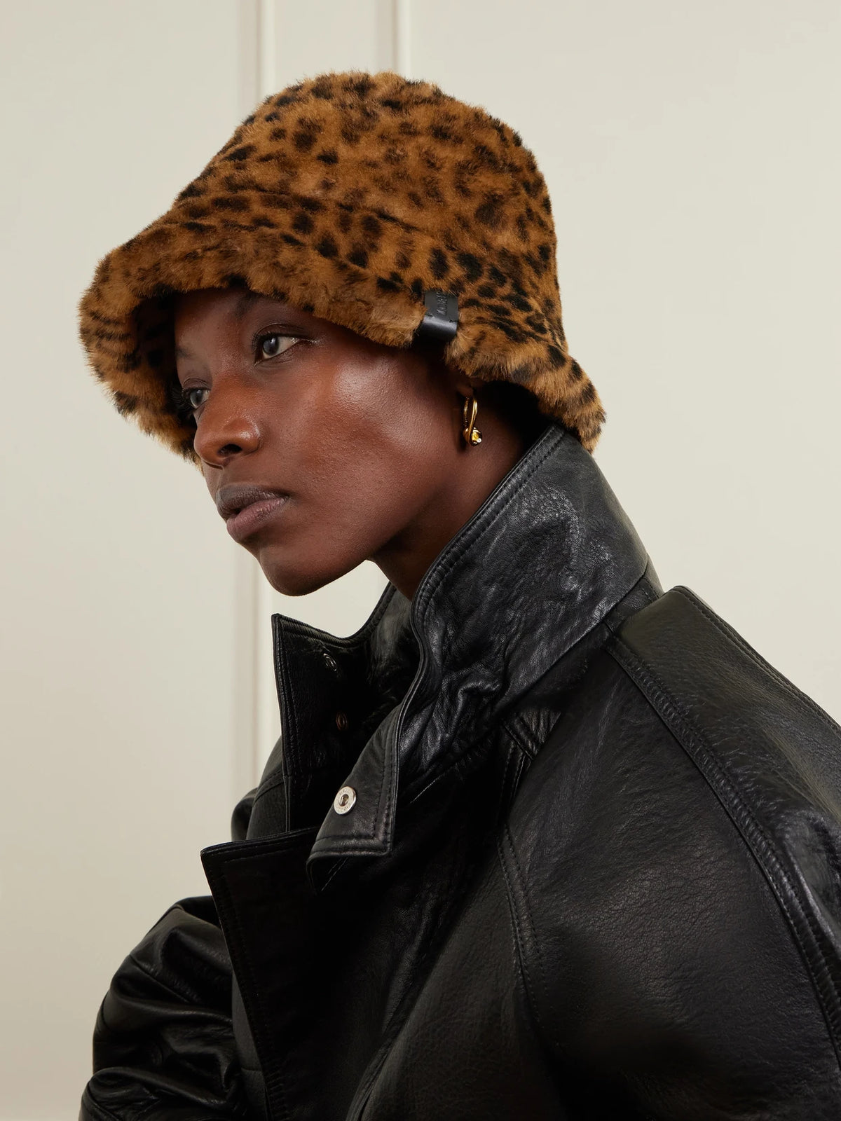 Image of Hats. Product name - Leather-trimmed Leopard-print Shearling Bucket Hat in Leopard print colour by brand - LOEWE