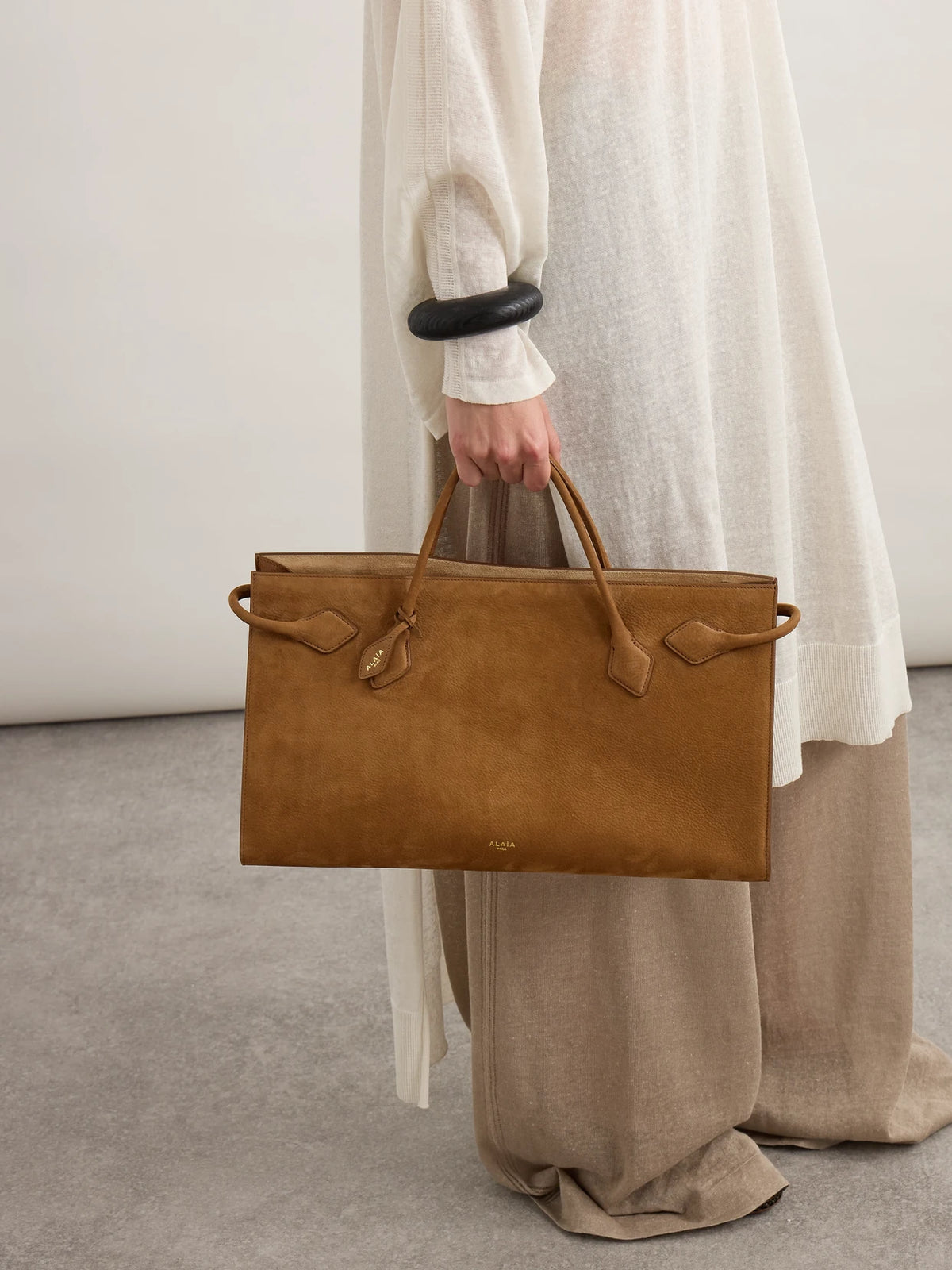 Image of Bags. Product name - East West Nubuck Tote in Brown colour by brand - Alaïa