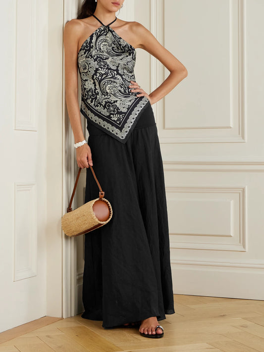 Image of a model wearing Skirts. Product name - Light And Sound Convertible Linen-blend Maxi Skirt in Black colour by brand - Johanna Ortiz
