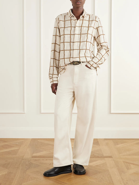 Image of a model wearing Tops. Product name - Embroidered Woven Silk Shirt in Cream colour by brand - Kartik Research