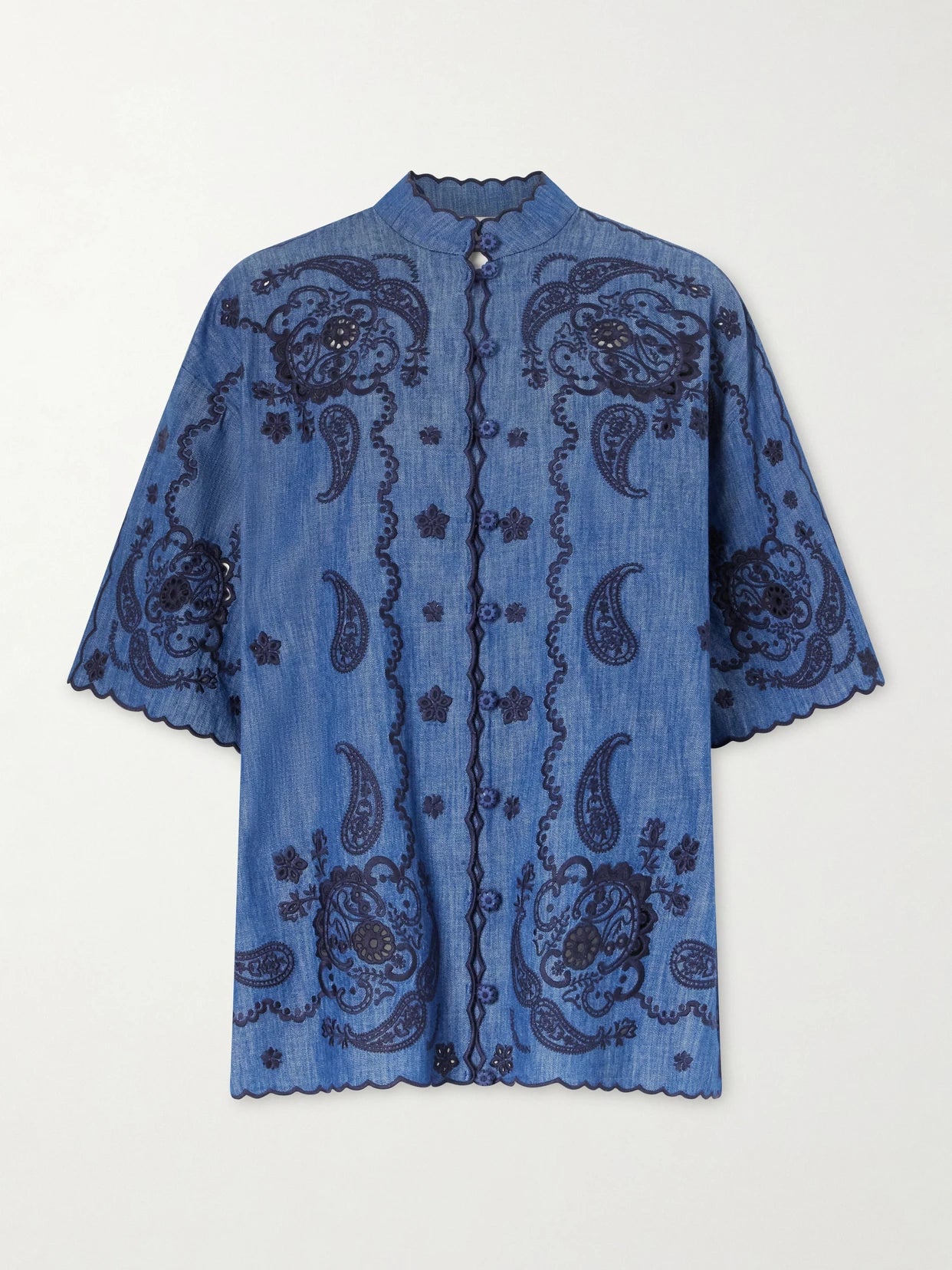 Image of a model wearing Tops. Product name - Aster Embroidered Denim Shirt in Blue colour by brand - Zimmermann