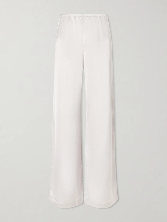 Image of a model wearing Pants. Product name - Barb Satin Wide-leg Pants in Silver colour by brand - LESET