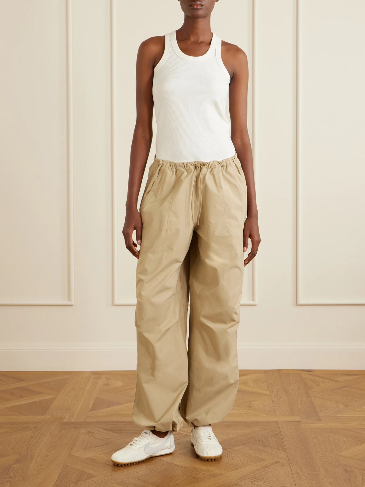 Image of a model wearing Tops. Product name - All-day Ribbed Stretch Lyocell And Cotton-blend Tank in Ivory colour by brand - ON