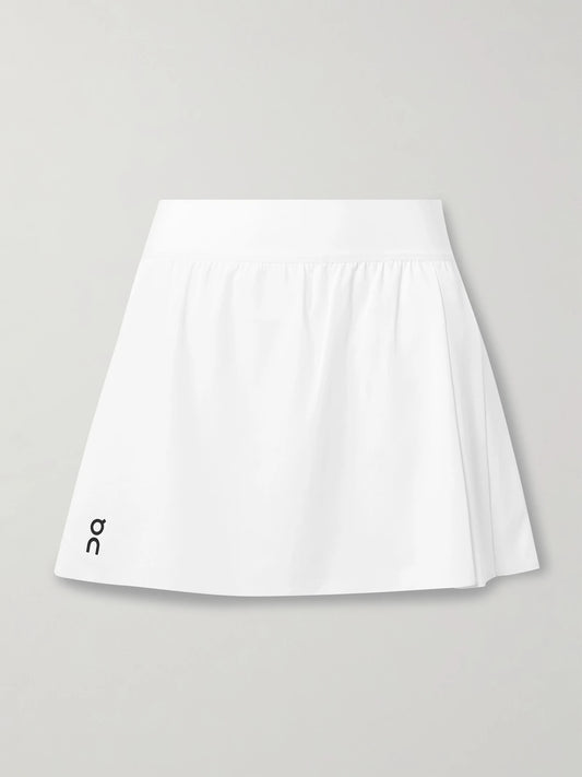 Image of a model wearing Tops. Product name - Court Pleated Recycled-jersey Tennis Skirt in White colour by brand - ON