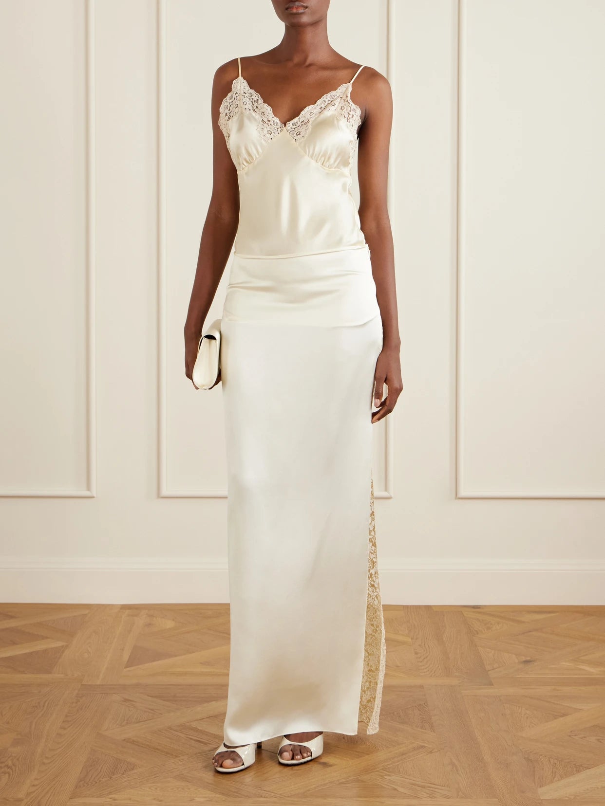 Image of a model wearing Skirts. Product name - Lace-trimmed Silk-satin Maxi Skirt in Sand colour by brand - Colleen Allen