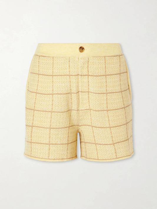 Image of a model wearing Shorts. Product name - Checked Knitted Cashmere And Linen-blend Shorts in Yellow colour by brand - Guest In Residence