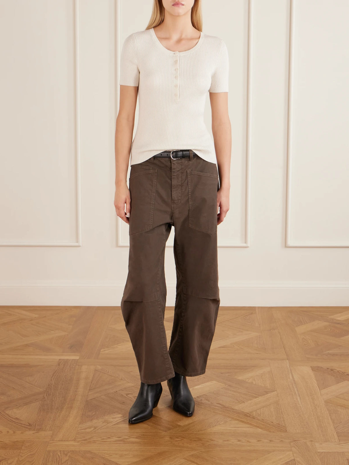 Image of a model wearing Tops. Product name - Francene Ribbed Wool And Silk-blend Top in Ivory colour by brand - Nili Lotan