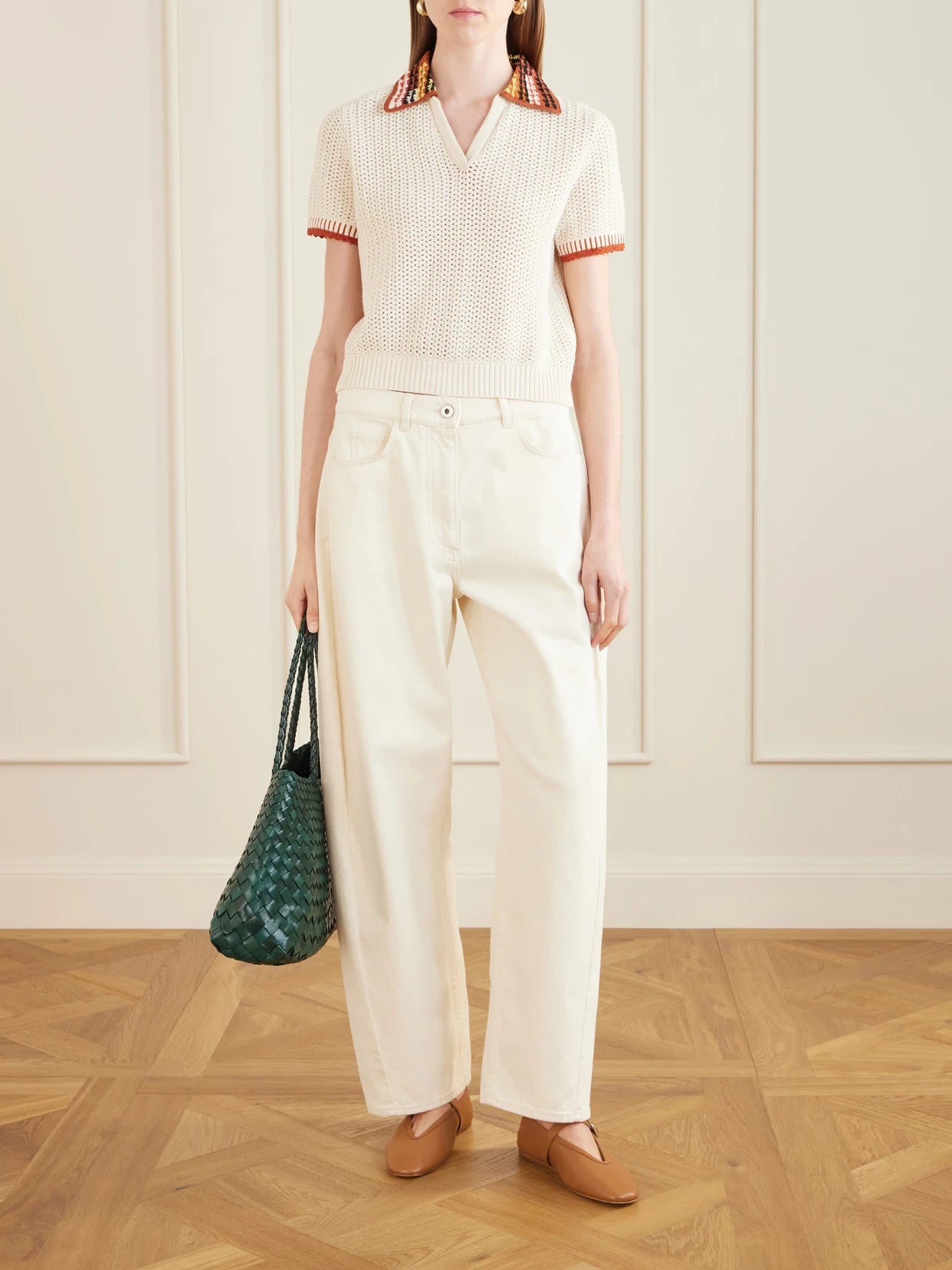 Image of a model wearing Outerwear. Product name - Lauri Crocheted Cotton Polo Shirt in Ivory colour by brand - ESCVDO