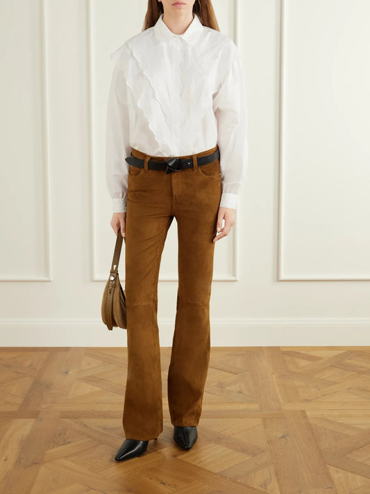Image of a model wearing Pants. Product name - The Rodeo Suede Flared Pants in Light brown colour by brand - FRAME