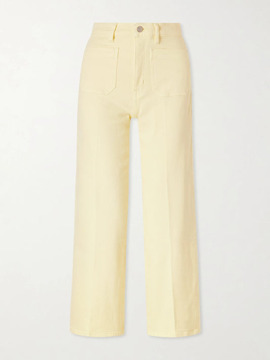 Image of a model wearing Pants. Product name - High Rise Slim Wide Cotton-blend Wide-leg Pants in Yellow colour by brand - FRAME
