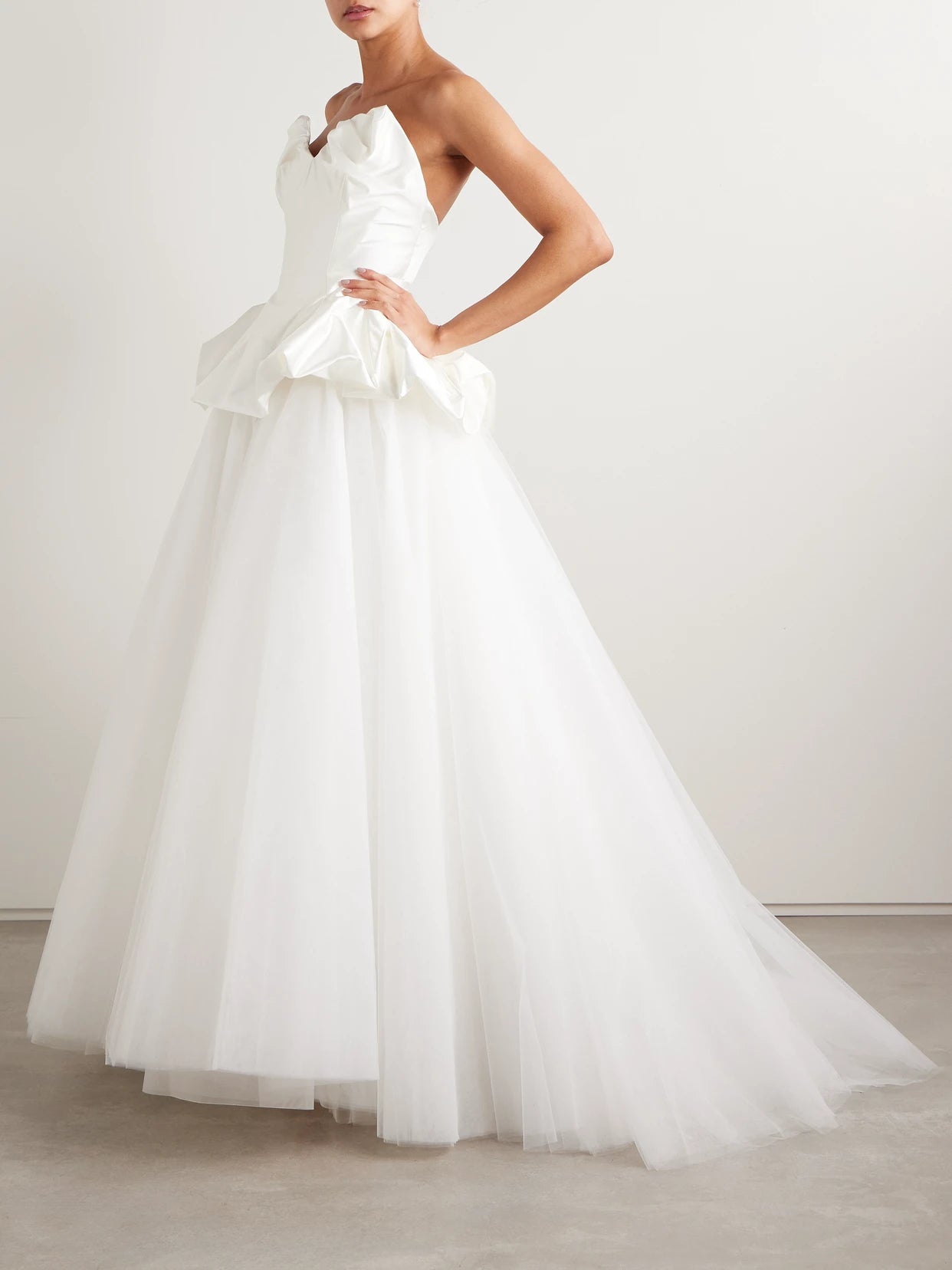 Image of a model wearing Skirts. Product name - Joe Petticoat Satin-trimmed Tulle And Crinoline Maxi Skirt in Ivory colour by brand - Vivienne Westwood