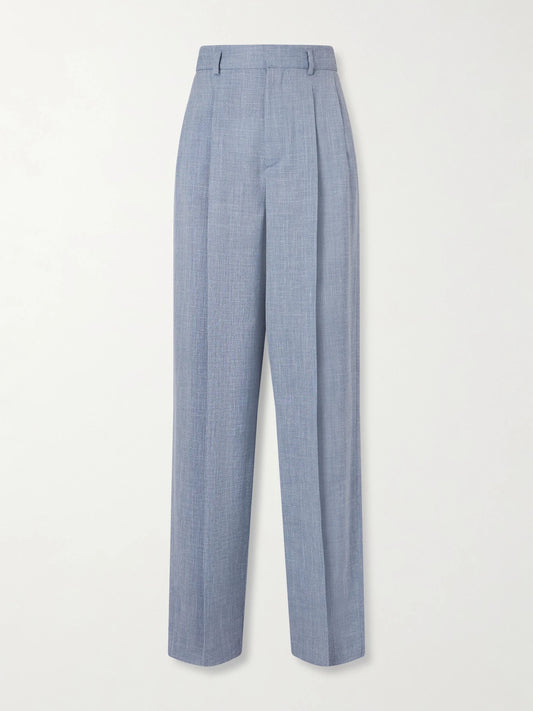 Image of a model wearing Pants. Product name - Hector Pleated Wool, Silk And Linen-blend Wide-leg Pants in Light blue colour by brand - Loro Piana