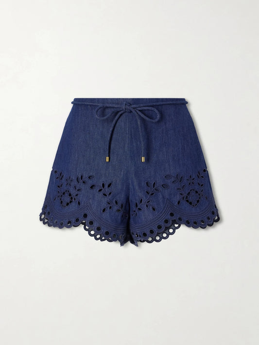 Image of a model wearing Shorts. Product name - Mahon Broderie Anglaise Denim Shorts in Blue colour by brand - Zimmermann