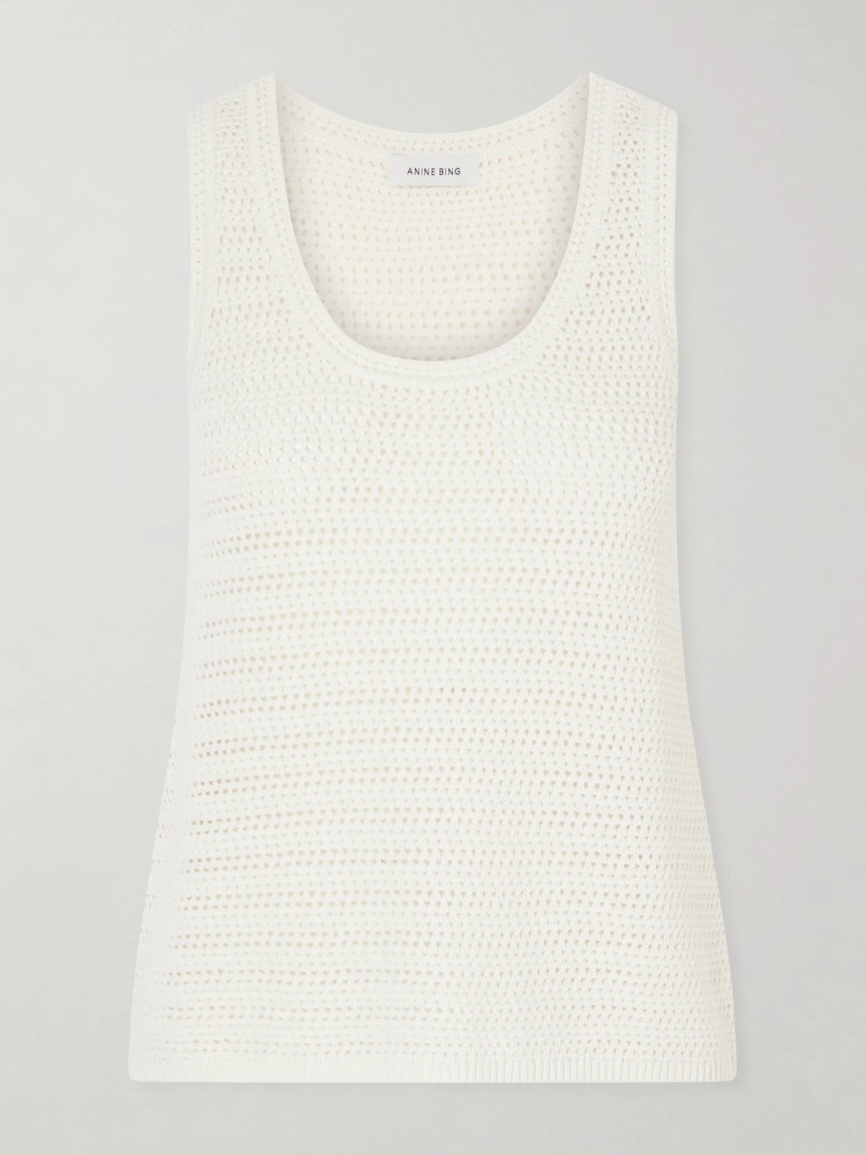 Image of a model wearing Tops. Product name - Arie Open-knit Cotton-blend Tank in Ecru colour by brand - Anine Bing