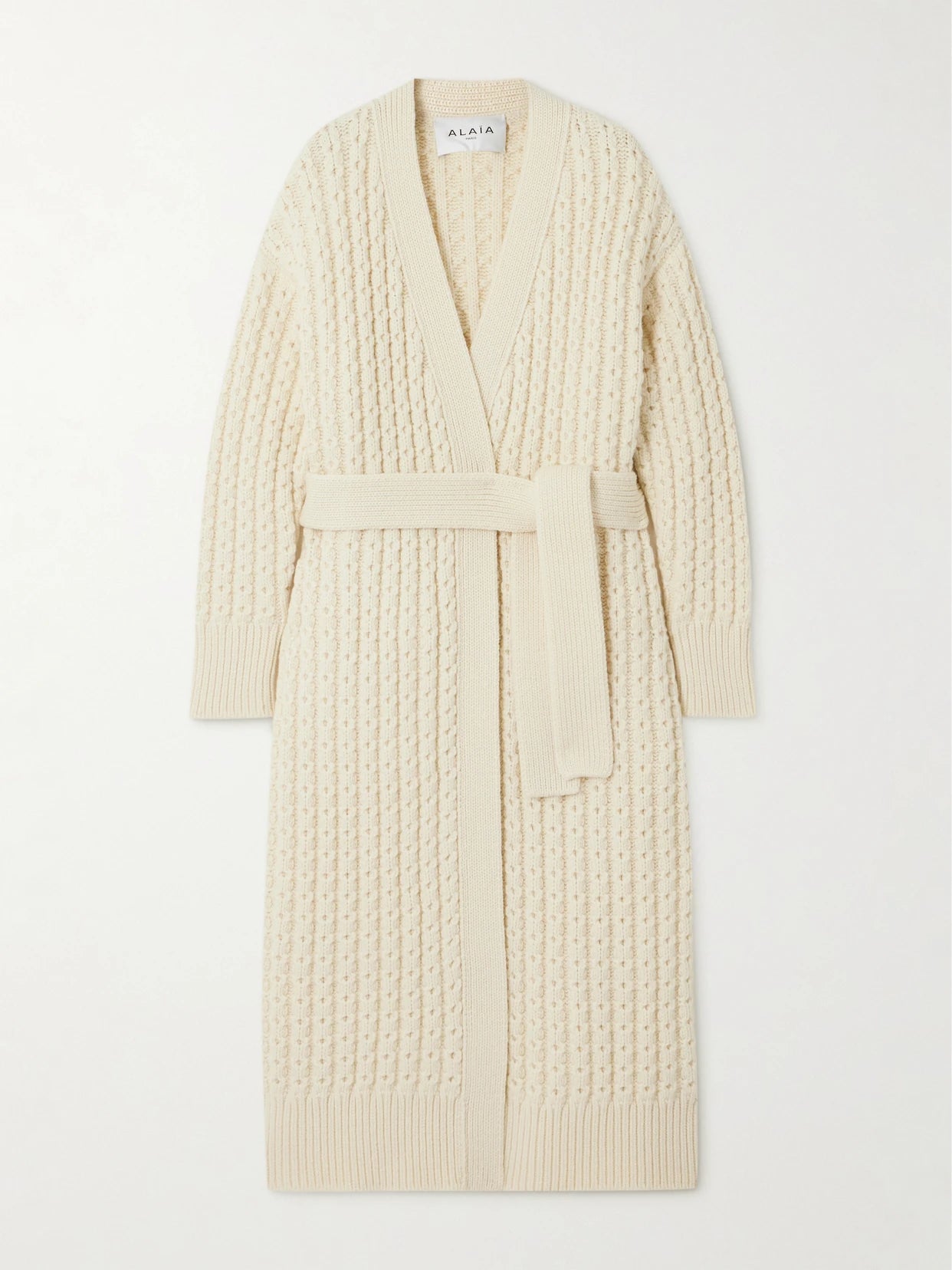 Image of a model wearing Outerwear. Product name - Oversized Wool Cardigan in Ivory colour by brand - Alaïa