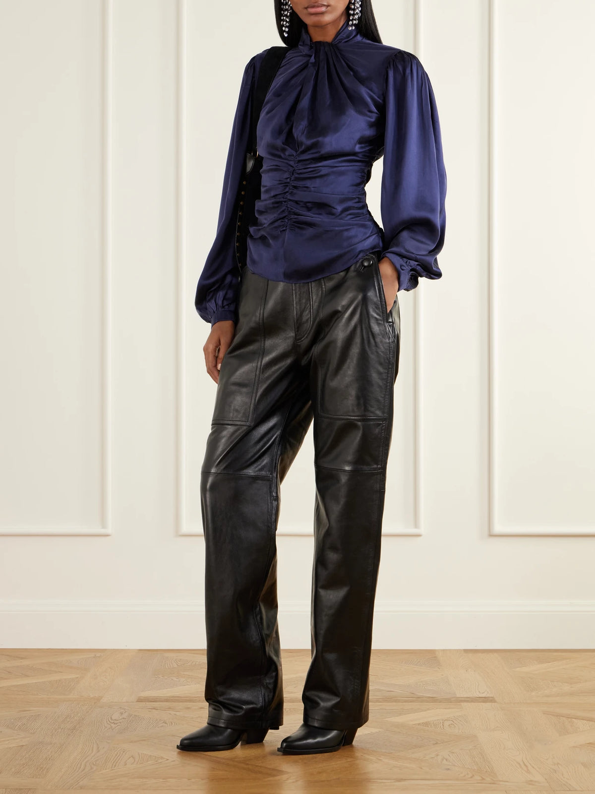 Image of a model wearing Pants. Product name - Valka Leather Wide-leg Pants in Black colour by brand - ISABEL MARANT