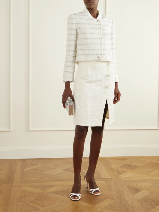 Image of a model wearing Skirts. Product name - Floral-embellished Denim Midi Skirt in Cream colour by brand - Self-Portrait