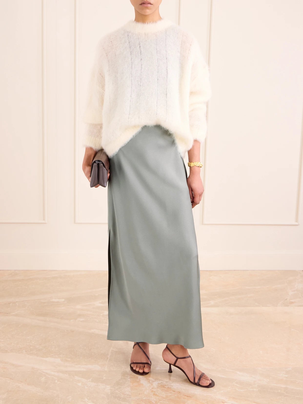 Image of a model wearing Skirts. Product name - Satin Midi Skirt in Green colour by brand - Brunello Cucinelli