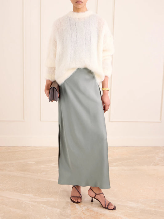 Image of a model wearing Skirts. Product name - Satin Midi Skirt in Green colour by brand - Brunello Cucinelli