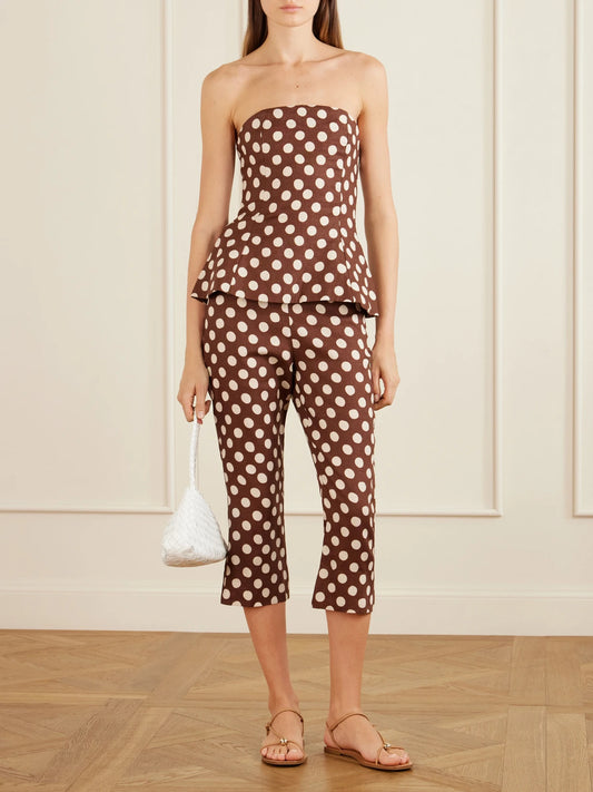 Image of a model wearing Pants. Product name - Valeria Polka-dot Linen Straight-leg Capri Pants in Brown colour by brand - Faithfull