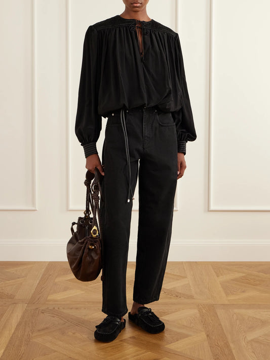 Image of a model wearing Tops. Product name - Dovane Silk-satin Blouse in Black colour by brand - ISABEL MARANT
