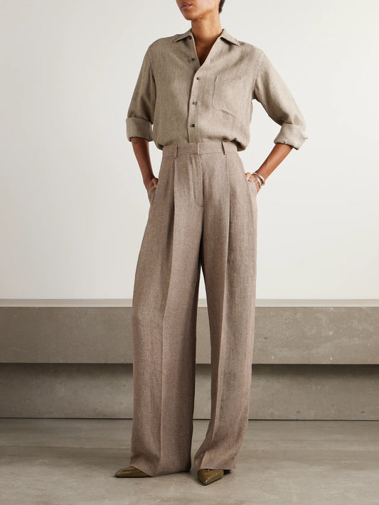 Image of a model wearing Pants. Product name - Kurt Pleated Linen Wide-leg Pants in Brown colour by brand - Loro Piana