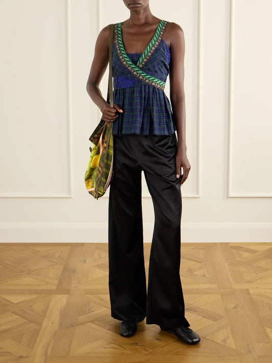 Image of a model wearing Pants. Product name - Puvis Wide-leg Satin Pants in Black, Chocolate colour by brand - Dries Van Noten