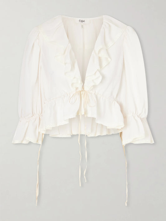 Image of a model wearing Tops. Product name - Lace-trimmed Ruffled Silk-georgette Blouse in White colour by brand - Chloé