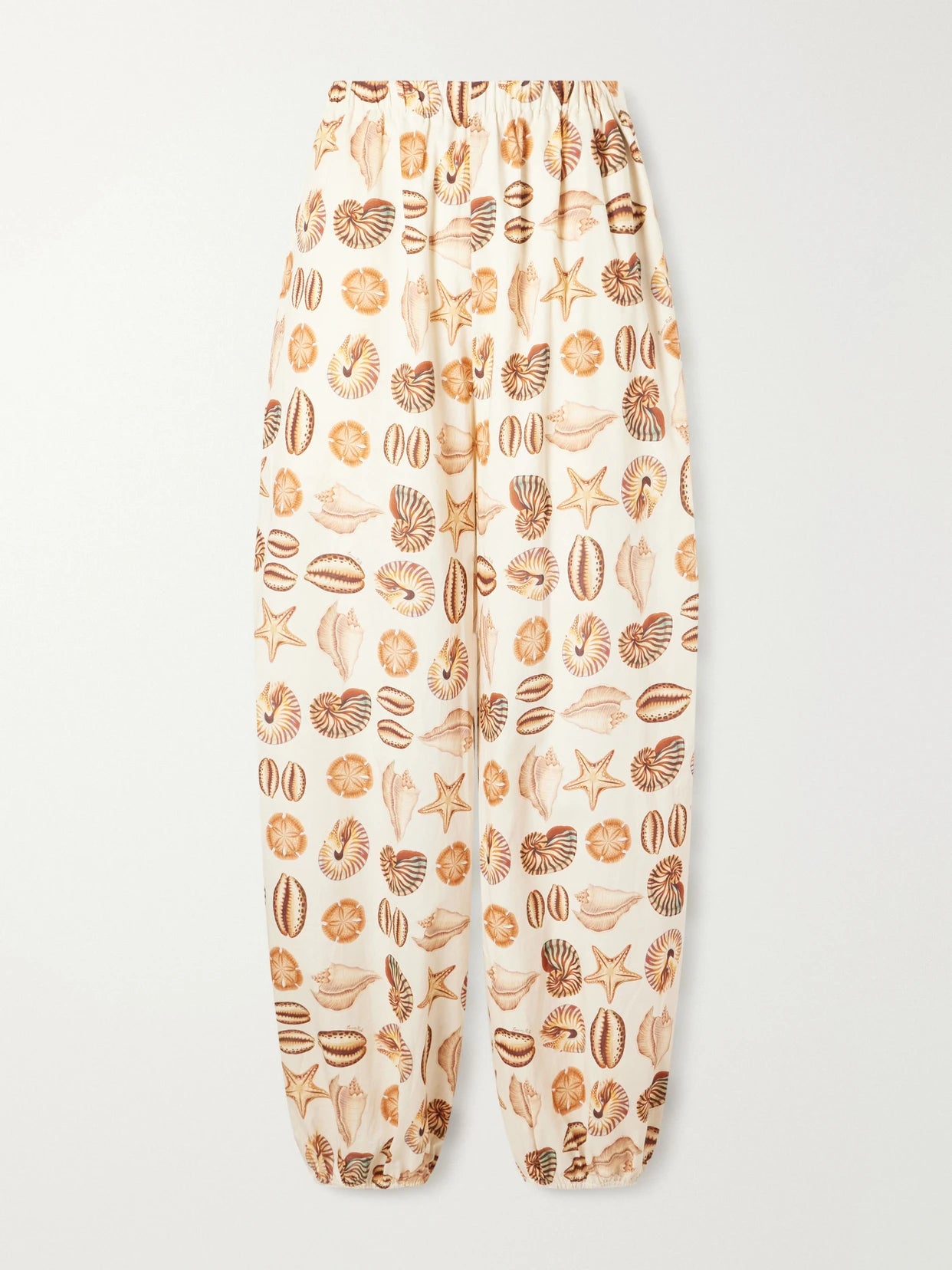 Image of a model wearing Pants. Product name - Printed Cotton Balloon Pants in Sand colour by brand - Farm Rio