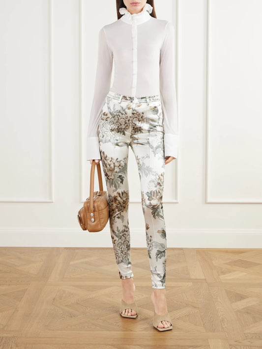 Image of a model wearing Pants. Product name - Floral-print Satin Skinny-leg Pants in Beige colour by brand - Acne Studios